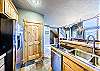 Kitchen with bar/peninsula. Stainless steel appliances