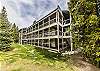 Exterior view of building. Quiet neighborhood near trees and parks, walking trails, and the Fraser River.