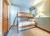 Twin over queen bunk bed on lower level bedroom