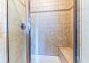 Primary bathroom shower with glass door