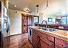 Double sink, ample counter space, and a variety of cooking utensils for creating the perfect vacation meal.