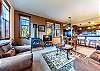 Living area, dining area, and kitchen all flow together nicely within the open floor plan.