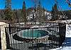 Relax in the large shared hot tub after a day in the mountains