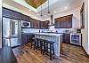 Beautiful kitchen wth granite counter tops and stainless steel appliances