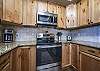 Kitchen with stainless steel appliances & granite countertops