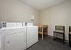 Coin operated laundry room only few steps from condo