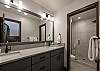 Hall bathroom on the lower level across the hall from the secondary master bedroom.