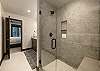 Walk in shower with built in shower bench. 