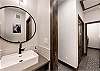 Upon entry to the home, there is a powder room on the left. and a laundry room on the right. 
