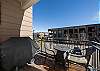 Balcony off living area with BBQ and table to enjoy morning coffee in the warmer months
