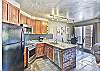 Living area, dining area, and kitchen all flow together nicely with the open floor plan.