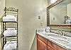 Large vanity mirror, granite counter, and great lighting.