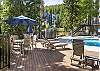 Enjoy being poolside in the summer under a patio umbrella. 