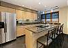 Seating for 4 guests at the kitchen island.