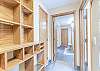 Hall way offers storage for all of your outerwear, and leads to the main areas of the unit.
