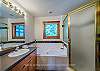 En-Suite Bathroom-
Jetted garden tub, and glass shower stall.