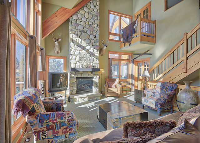 Living Area-
Plenty of seating, TV, fireplace, natural lighting, and private balcony access.