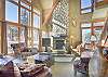 Living  Area-
Vaulted ceiling, and stone hearth fireplace.