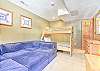 Fourth Bedroom-
Twin-over-full bunk with large couch, creating additional sleeping space. Located on the lower entry level.