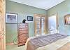 Second Bedroom-
Flat screen TV, french doors to access the living room. 