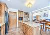 Kitchen island offers granite top and seating.