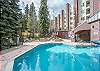 Outdoor portion of the heated pool with two outdoor hot tubs.