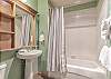 Pedestal sink and large mirror. Located off the entry.