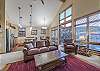 Living area, dining area, and kitchen all flow together nicely with the open floor plan.