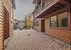 Brick path to the unit's ground level entrance door.