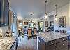 Kitchen-
Granite counters, pendant lighting, and seating at the island.