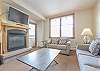 Living Area-
Offers a flat screen TV, gas fireplace, queen size sofa sleeper, and access to the private balcony. 