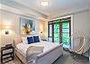 Spacious 2nd Bedroom (lower floor) with ensuite bathroom (leads onto patio)