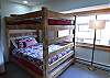 Second bedroom has a queen-sized bunk bed and a twin-sized bunk bed. 