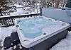 Guests can relax in the private hot tub located on the back patio. 