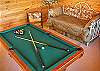 Game room upstairs with pool table and 1 futon 