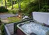 Settle into the bubbling embrace of your private hot tub.