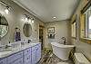 Primary Bathroom with large soaking tub and double vanity 