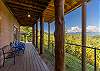 covered deck with seating facing the mountains. 