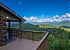 Open deck with view of mountains. 