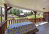 Picnic table on side porch. 