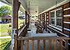 Front Porch with rocking chairs and swing. 