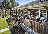 Front porch with rocking chairs and swing.