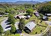 Aerial view of home and surrounding cabins. 