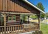 covered porch that wraps around 2 sides of the home. 