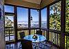 Screened porch with table and seating for 4. Beautiful mountain views. 