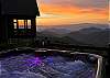 Hot tub overlooking mountain view. 