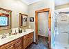 Full bathroom suite in primary bedroom with double sinks, walk in shower, and separate tub. 