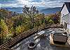 Back patio with firepit and hot tub. 