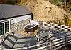 Back patio with firepit, hot tub, and seating for 6. 