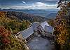 Exterior view of home surrounded by beautiful mountain scenery